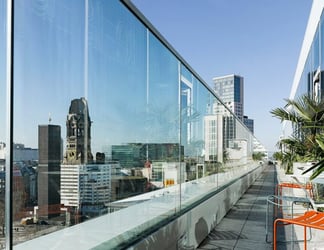 view of a city from a hotel balcony
