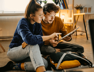 two people using a tablet device